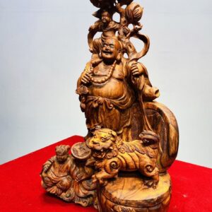 Tượng Di Lạc Nhị Tiểu vác cành đào đứng Nghê Gỗ Sưa